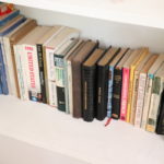 1 shelf Of Assorted Hard And Soft Cover Books