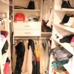 walk in closet with women's clothes