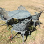 iron outdoor table with matching four chairs