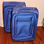 2 Medium Blue Delsey Suitcases With Pull Handles