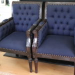 Pair Of Antique Custom Upholstered Captain's Chairs With Fluted Carvings And Ottoman