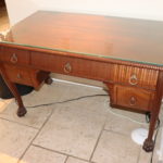 Antique Carved Wood Desk With Mahogany Finish, Bow Front And Claw Feet