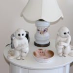 Small Round White Wood Table And Monkeys