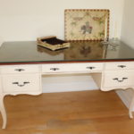 White Ethan Allen Desk With Parquet Top And Protective Glass With Decorative Items