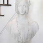 Marble Bust Of Beautiful Renaissance Woman With Laurel Wreath In Her Hair On Marble Plinth