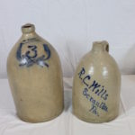 2 Antique Whiskey Jugs With Blue Decor