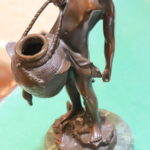 Bronze Sculpture On Marble Base Of Boy With Jug.