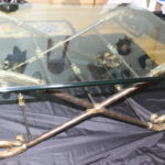 La Barge Style Glass Coffee Table With Beveled Edge On Decorative Metal Base With Brass Finish Feet