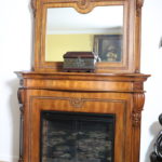Large Decorative Carved Wood Mantle With Detailed Trim And Electric Fireplace