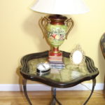 Decorative End Table With Floral Urn Lamp And Frames
