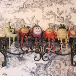 Ornate Metal Wall Shelf With Decorative Fruit Marionette Puppet Figures