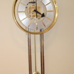 Howard Miller Brass And Glass Wall Clock With Key Needs Repair