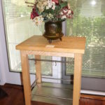 Wood And Stainless Kitchen Prep Table On Wheels , Measures 26" W X 20" D X 33" Tall With Decorative Faux Cente Lot #: 34