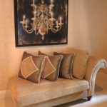 Chaise with Throw Pillows and Chandelier Painting