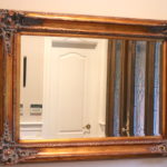 Large Decorative Carved Wood Mirror With Beveled Glass & Floral Detailed Corners