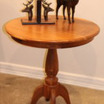 28" Round Side Table With Deer Head Bookends And Carved Wrapped Ram Statue