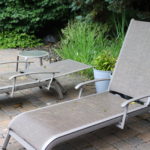 Pair Of Sunbrella Outdoor Lounge Chairs With Small End Table