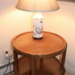 QUALITY ROUND WOOD SIDE TABLE AND PORCELAIN LAMP WITH FLORAL MOTIF AND ASIAN WOOD BASE