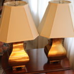 PAIR OF BRASS TABLE LAMPS WITH ASIAN MOTIF