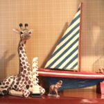 Wooden Sailboat With Decorative Giraffe And Elephants
