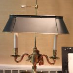 Brass Lamp With Stack Of Architectural Digest Books