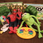 Mixed Lot Of Assorted Toys Includes Spiderman Figures, Hulk Fists, Kermit The Frog And Games