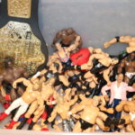 Mixed Lot Of Assorted Wrestling Figures Includes Toy Belts, Turtle Truck, Batman Cars And Darth Vader