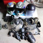 Lot Of Dirt Bike Helmets And Riding Gear