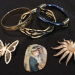 Assortment Of Bangles And Brooches