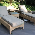 Pair Of Gloster Outdoor Wicker And Teak Adjustable Lounge Chairs With Cushions And Side Table