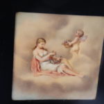 Vintage Hand Painted Porcelain Plaque “Woman & Cherub In Clouds” In Frame