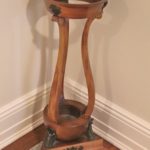Vintage Wood Plant Stand With Copper Colored Pot Filled With Faux Fern