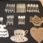 Christofle Acier Assorted Flatware And Trivets And Spoon Rests