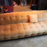 Vintage Mid Century Style Tufted Sofa Shows Fading In Fabric