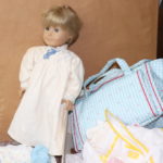American Girl Doll With Assortment Of Clothing