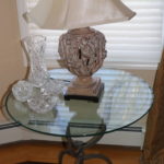 Beveled Glass Top Wrought Iron Style Tripod Table, Carved Tulip Base Table Lamp & Assorted Crystal